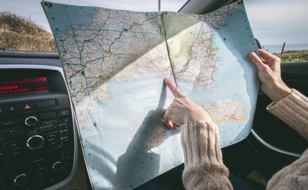 person pointing at a map