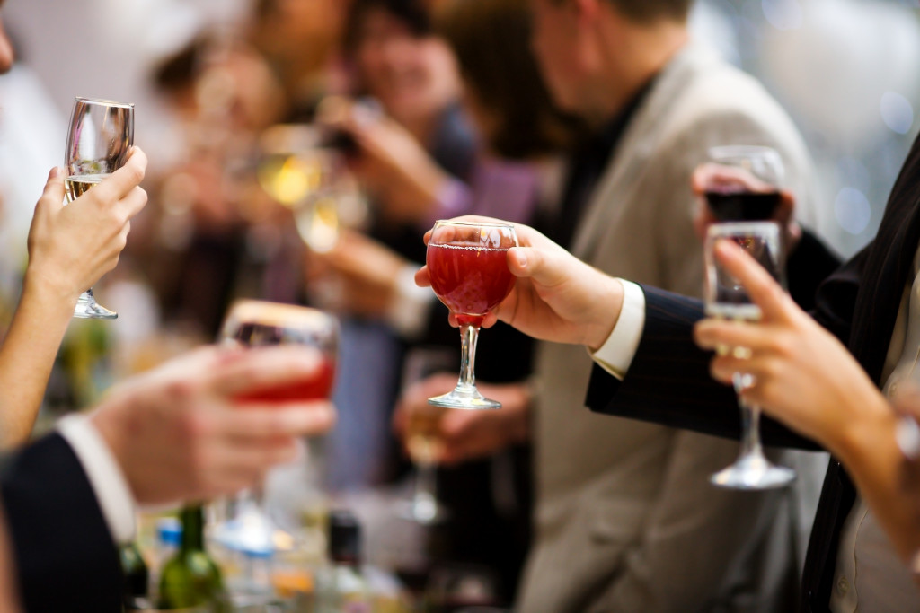guests toasting their alcoholic drink during an event