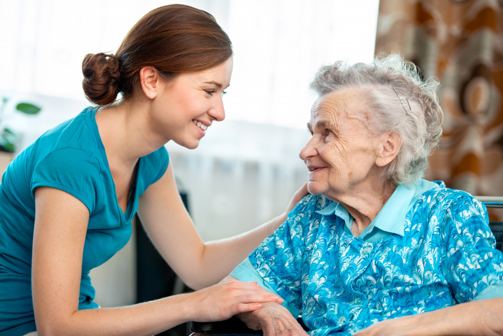 a female senior citizen with caregiver
