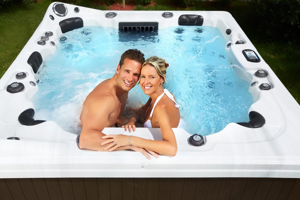 couple enjoying their outdoor hot tub